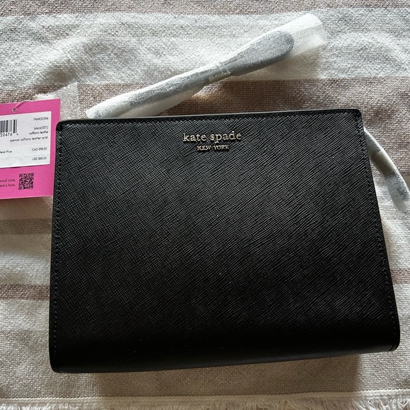 kate spade Handbags - NWT Kate Spade Clutch Wristlet Excellent Condition Unique Size Fits All You Need